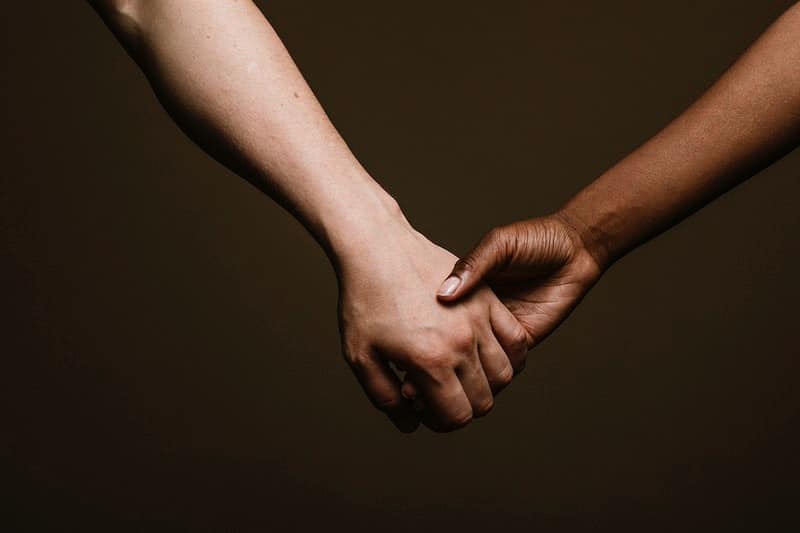 holding hand of a loved one