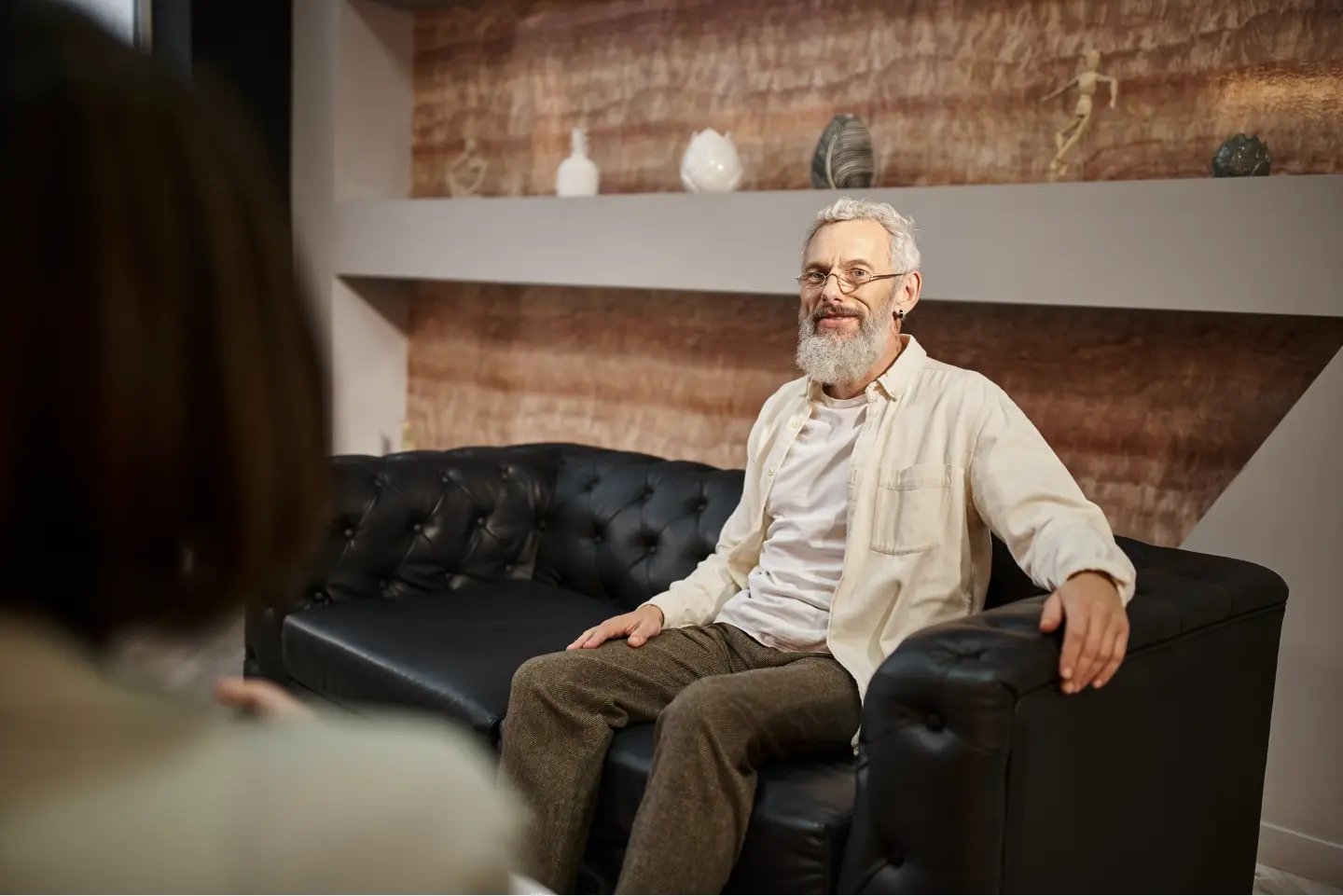 elderly man sitting in therapy