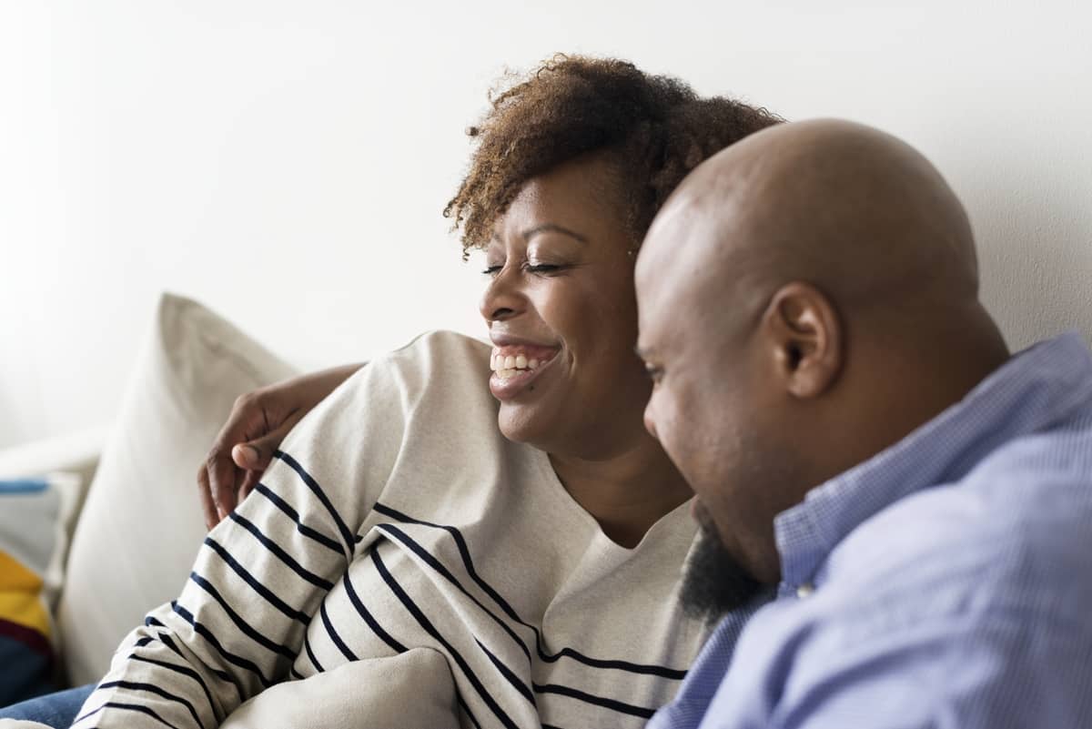 couple smiling on the couch