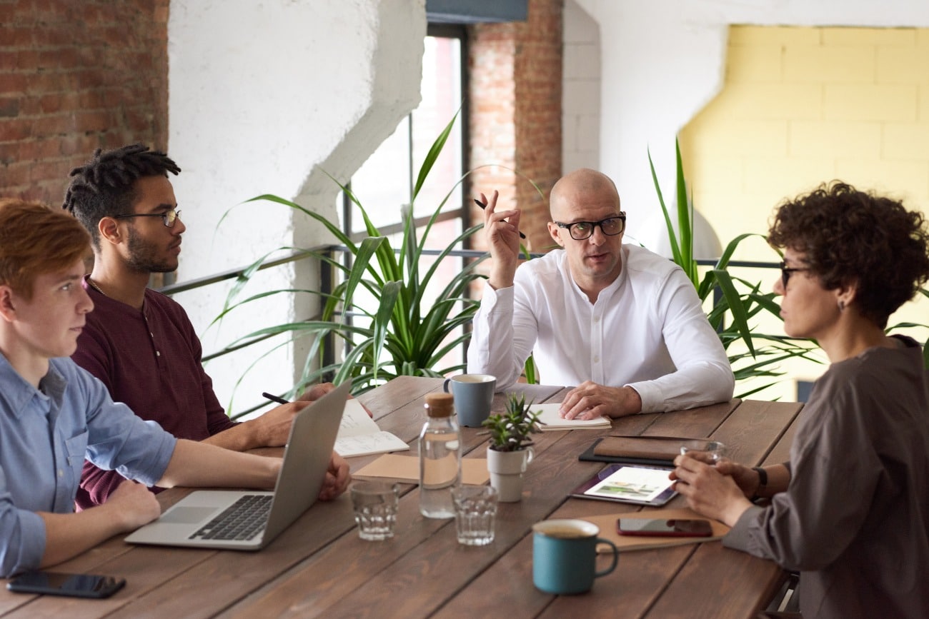 group of people all sitting at a table