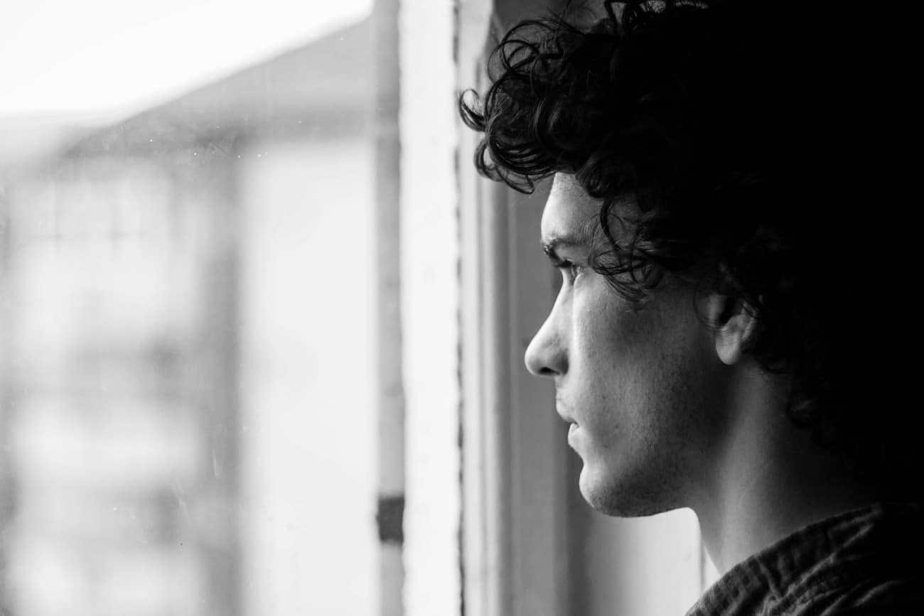 young man looking into distance