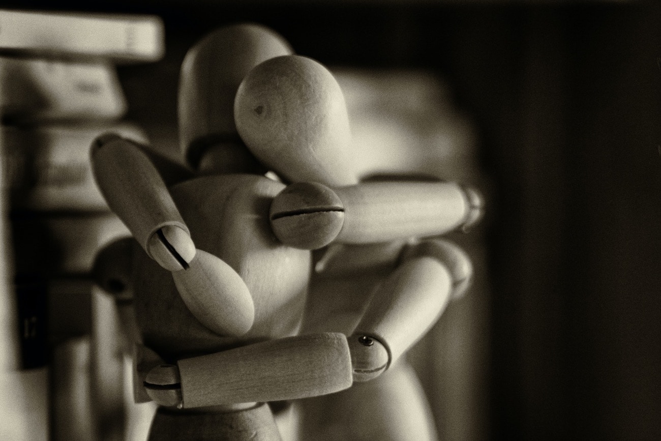 two human-like figures hugging