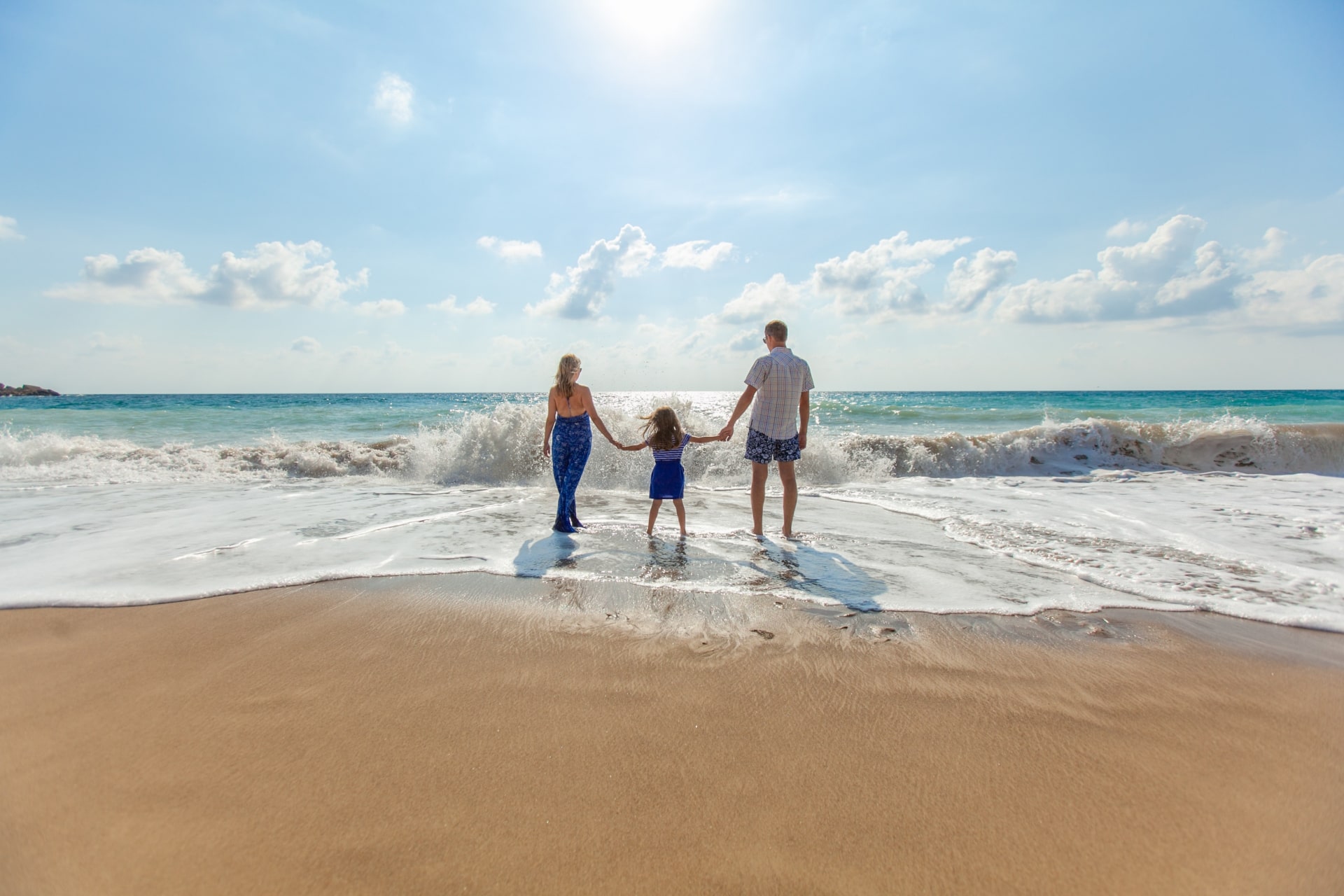 family walking on the beach